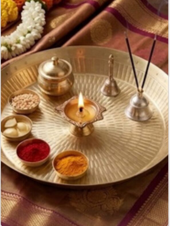 Brass pooja thali with diya