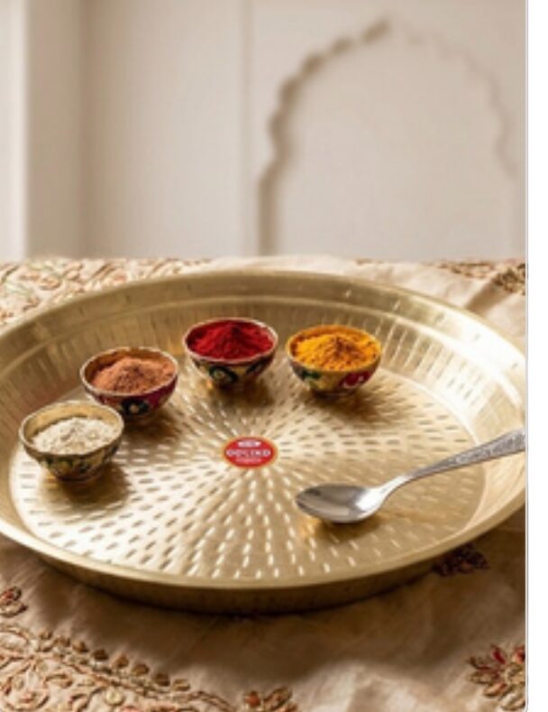 Brass thali with spice bowls